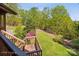 Wooden deck overlooking a landscaped yard with flowers and trees at 3605 Ridgetop Rd, Sherrills Ford, NC 28673