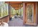Inviting porch with decorative front door and wooded views, perfect for relaxing outdoors at 3605 Ridgetop Rd, Sherrills Ford, NC 28673