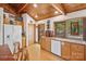 Kitchen featuring wood cabinets, tile countertops, stainless steel appliances, and wood-framed windows at 3605 Ridgetop Rd, Sherrills Ford, NC 28673