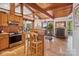 Kitchen view showing wood cabinets and a dining area flowing into the dining room and living room at 3605 Ridgetop Rd, Sherrills Ford, NC 28673