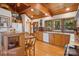 Kitchen featuring wood cabinets, tile countertops, stainless steel appliances, and wood-framed windows at 3605 Ridgetop Rd, Sherrills Ford, NC 28673
