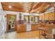 Kitchen featuring wood cabinets, tile countertops, stainless steel appliances, and wood-framed windows at 3605 Ridgetop Rd, Sherrills Ford, NC 28673