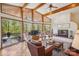 Bright living room with vaulted ceilings, fireplace and walls of windows offering serene views at 3605 Ridgetop Rd, Sherrills Ford, NC 28673