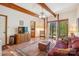 Inviting living room featuring wood beams, a sliding glass door, and tile flooring at 3605 Ridgetop Rd, Sherrills Ford, NC 28673