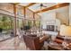 Bright living room with vaulted ceilings, fireplace and walls of windows offering serene views at 3605 Ridgetop Rd, Sherrills Ford, NC 28673