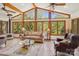 Cozy living room with large windows offering views of the surrounding greenery and vaulted ceilings at 3605 Ridgetop Rd, Sherrills Ford, NC 28673