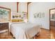 Comfortable main bedroom featuring wood floors, ample natural light, and classic decor at 3605 Ridgetop Rd, Sherrills Ford, NC 28673