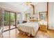Bright main bedroom with vaulted ceilings, wood floors, and a private balcony at 3605 Ridgetop Rd, Sherrills Ford, NC 28673