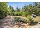 A grassy yard with mixed trees, a mailbox, and a partially sunny and shaded area at 3605 Ridgetop Rd, Sherrills Ford, NC 28673