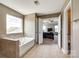 Bathroom featuring a soaking tub, tile flooring, and an open doorway to a bedroom at 4013 Highgate Ln # 2B-78, Lancaster, SC 29720