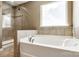 Relaxing bathroom featuring a soaking tub and a separate glass shower enclosure at 4013 Highgate Ln # 2B-78, Lancaster, SC 29720