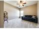 Neutral bedroom offers a comfortable sofa, plush carpet, and natural light at 4013 Highgate Ln # 2B-78, Lancaster, SC 29720