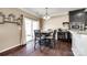 Bright dining area features hardwood floors, sliding glass door, and stylish chandelier at 4013 Highgate Ln # 2B-78, Lancaster, SC 29720