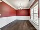 Formal dining room with rich wood flooring, chandelier, and a large window offering ample natural light at 4013 Highgate Ln # 2B-78, Lancaster, SC 29720