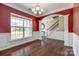 Dining room with an arched entry way, large window, elegant chandelier, and hardwood floors at 4013 Highgate Ln # 2B-78, Lancaster, SC 29720