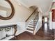 Staircase with hardwood floors, an ornate mirror, and views into adjoining rooms at 4013 Highgate Ln # 2B-78, Lancaster, SC 29720