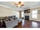 Inviting living room with hardwood floors, fireplace, ceiling fan, and large windows at 4013 Highgate Ln # 2B-78, Lancaster, SC 29720