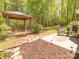 Private backyard featuring a cozy gazebo, patio area, and lush greenery at 4628 Arthur Way, Rock Hill, SC 29732