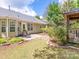 The backyard features a stone patio, garden and quaint gazebo area at 4628 Arthur Way, Rock Hill, SC 29732