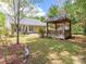 Serene backyard with lush landscaping, a gazebo, and outdoor seating area at 4628 Arthur Way, Rock Hill, SC 29732