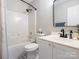 Bathroom boasts modern fixtures, a tub, and a stylish vanity, all set against a chic black and white patterned floor at 4628 Arthur Way, Rock Hill, SC 29732
