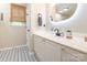 Chic bathroom with modern vanity, stylish mirror, and unique patterned tile flooring at 4628 Arthur Way, Rock Hill, SC 29732