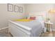 Bedroom with white wood bed frame, cozy bedding, and decorative art creates a warm and inviting space at 4628 Arthur Way, Rock Hill, SC 29732