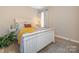 Bedroom with white wood bed frame, cozy bedding, and patterned curtains enhances the room's bright and airy ambiance at 4628 Arthur Way, Rock Hill, SC 29732
