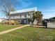 Exterior of building with metal roof, stone base, covered balconies and palm trees at 4628 Arthur Way, Rock Hill, SC 29732