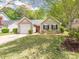Charming single-Gathering home with a well-manicured lawn, tidy landscaping, and an inviting orange front door at 4628 Arthur Way, Rock Hill, SC 29732