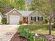 Charming single-Gathering home with well-maintained lawn, colorful landscaping, and welcoming orange front door at 4628 Arthur Way, Rock Hill, SC 29732