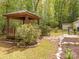 Beautiful backyard gazebo surrounded by landscaping and stone pathway at 4628 Arthur Way, Rock Hill, SC 29732