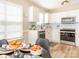 Bright kitchen features white cabinets, stainless steel appliances, and modern subway tile backsplash at 4628 Arthur Way, Rock Hill, SC 29732