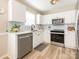 Stylish kitchen with white cabinets, stainless steel appliances, and a chic subway tile backsplash at 4628 Arthur Way, Rock Hill, SC 29732