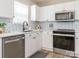 Modern kitchen features white cabinets, stainless steel appliances, and subway tile backsplash at 4628 Arthur Way, Rock Hill, SC 29732