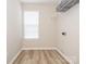 Bright laundry room with storage shelf, white walls, and light wood floors offers a clean and functional space at 4628 Arthur Way, Rock Hill, SC 29732