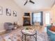 Inviting living room with a fireplace, vaulted ceiling, modern furnishings, and ample natural light at 4628 Arthur Way, Rock Hill, SC 29732