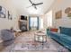 Bright living room featuring a fireplace, ceiling fan, and contemporary furnishings, offering a cozy atmosphere at 4628 Arthur Way, Rock Hill, SC 29732