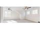 Spacious bedroom with two large windows, two ceiling fans, and neutral carpet at 472 Bellingshire Dr, Mt Ulla, NC 28125