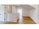 Open hallway with hardwood floors, leading to other areas of the home at 472 Bellingshire Dr, Mt Ulla, NC 28125