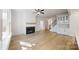 Bright, spacious living room with fireplace, hardwood floors, and ample natural light at 472 Bellingshire Dr, Mt Ulla, NC 28125
