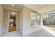 Welcoming porch features brick facade, ample natural light, and a view of the wooded property at 472 Bellingshire Dr, Mt Ulla, NC 28125