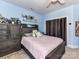 Bedroom featuring a ceiling fan, closet, and a cozy bed with drawers at 7012 Chadwyck Farms Dr, Charlotte, NC 28226
