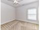 Neutral bedroom featuring a ceiling fan, and a window with blinds at 7012 Chadwyck Farms Dr, Charlotte, NC 28226