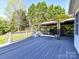 The expansive wooden deck, complete with a gazebo, overlooks a lush, green backyard, ideal for outdoor gatherings at 7012 Chadwyck Farms Dr, Charlotte, NC 28226