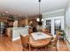 Dining area located off kitchen features a round wood table and outdoor access at 7012 Chadwyck Farms Dr, Charlotte, NC 28226
