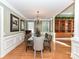 Elegant dining room with a glass table and hardwood floors at 7012 Chadwyck Farms Dr, Charlotte, NC 28226