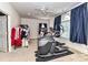 Exercise room with exercise equipment, neutral walls, and natural light at 7012 Chadwyck Farms Dr, Charlotte, NC 28226