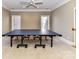 Game room featuring a professional ping pong table, and ample natural light from the two large windows at 7012 Chadwyck Farms Dr, Charlotte, NC 28226