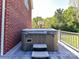Relax and unwind in the hot tub on the deck, with privacy and a view of the surrounding greenery at 7012 Chadwyck Farms Dr, Charlotte, NC 28226